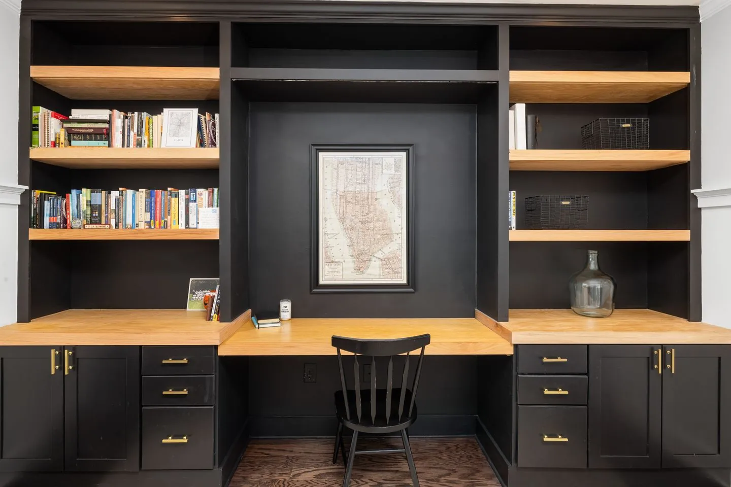 Built-in desk with bookshelves and a wooden chair