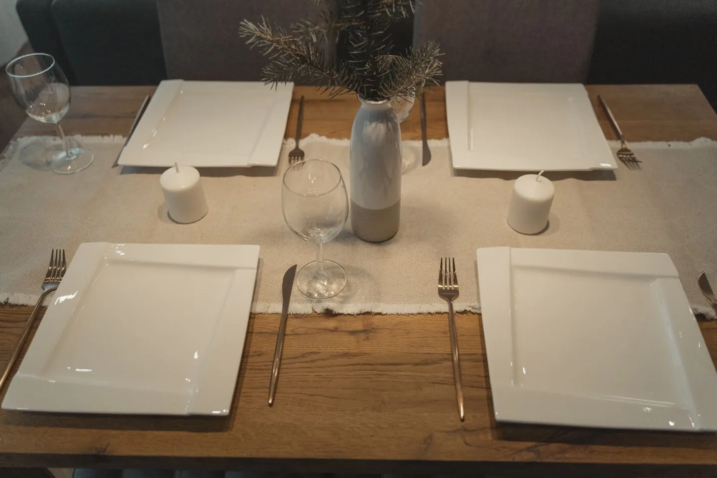 Simple dining-table setting with plates and glasses