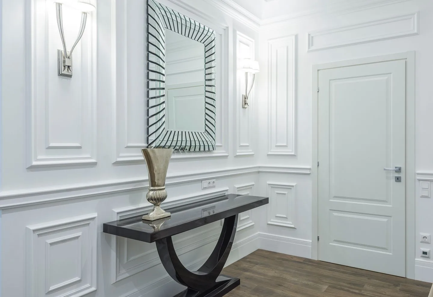 Hallway console table beneath a decorative mirror