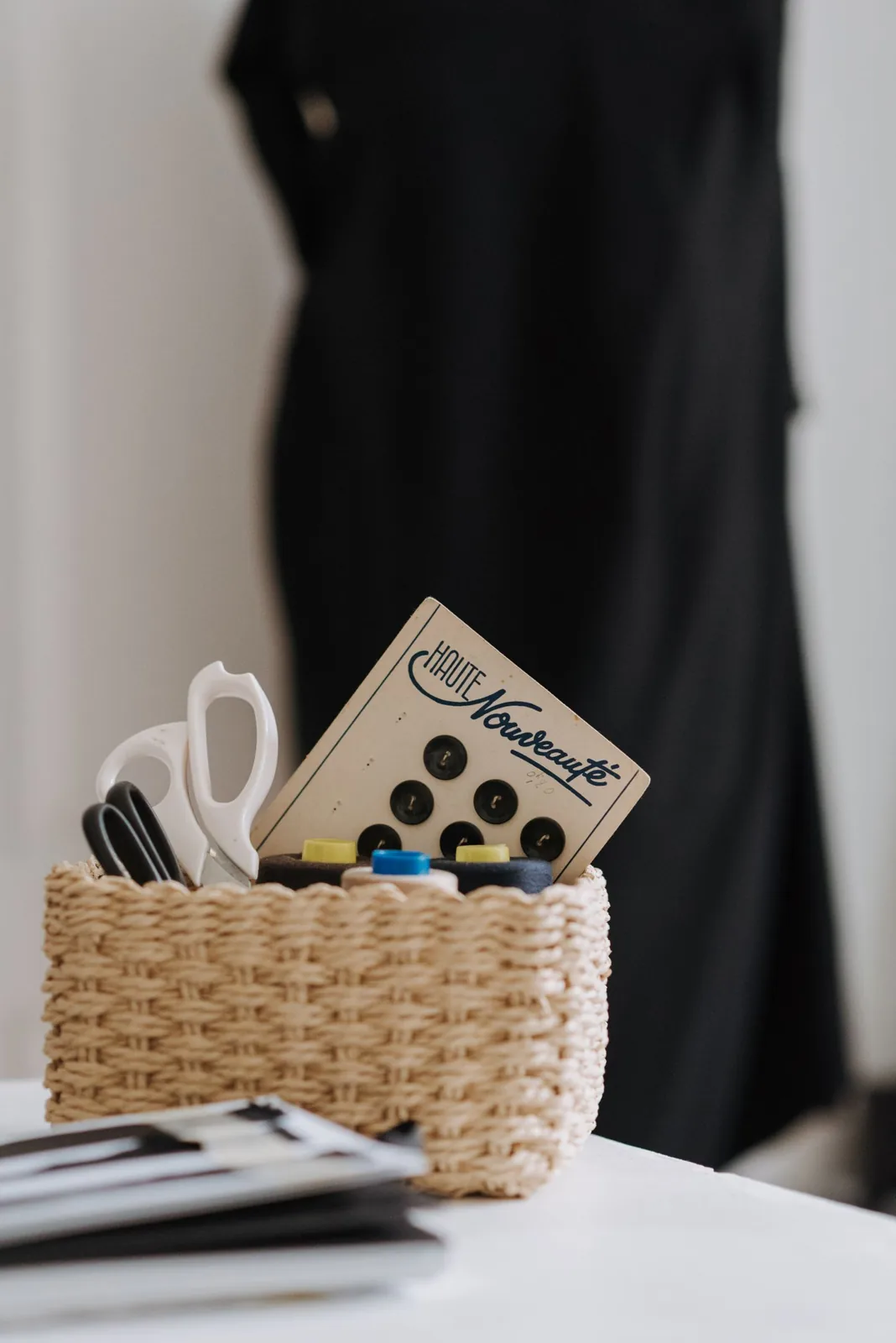 Sewing supplies kept together in a small woven basket