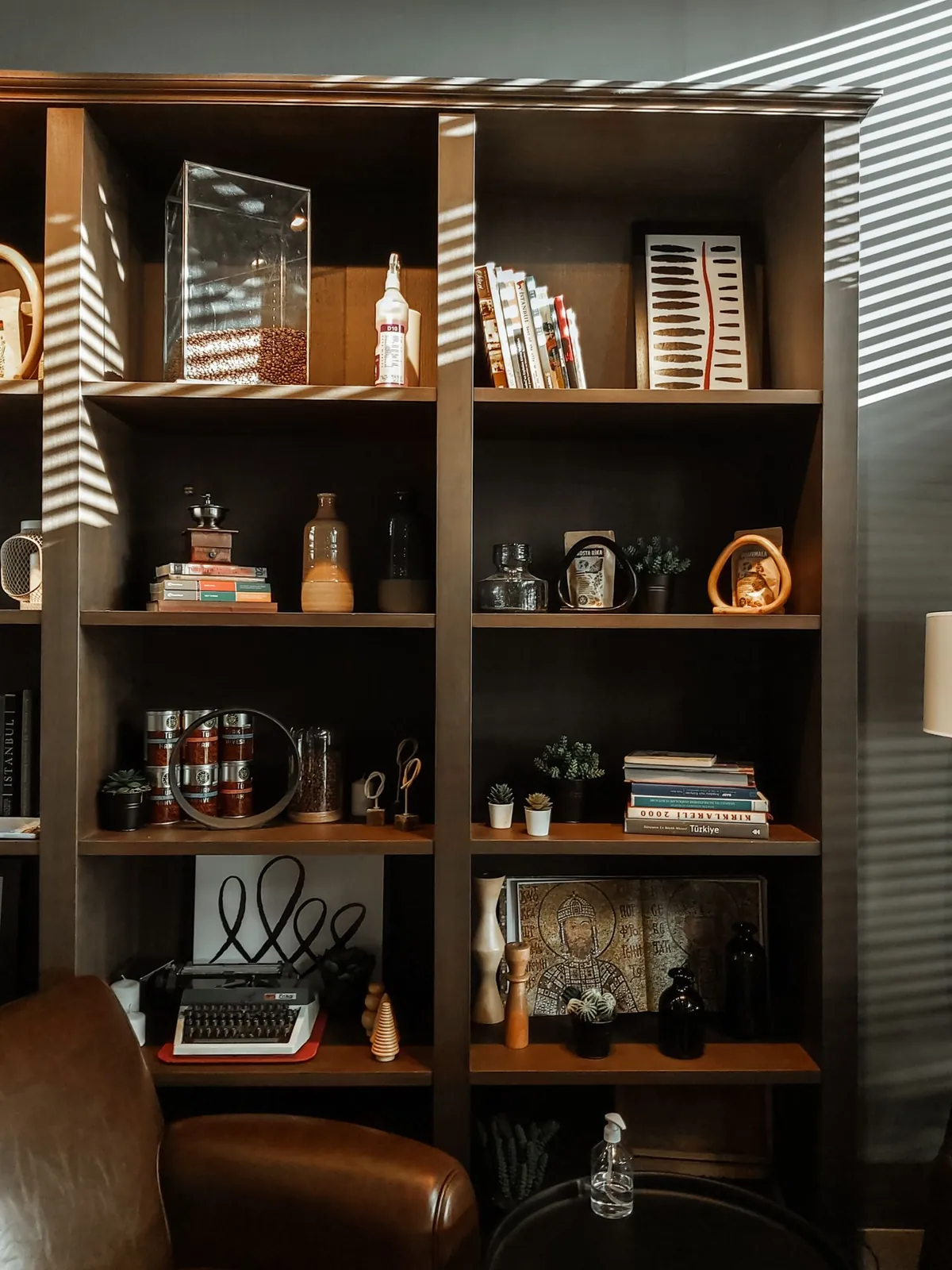 Open shelving holding books, baskets and decorative objects