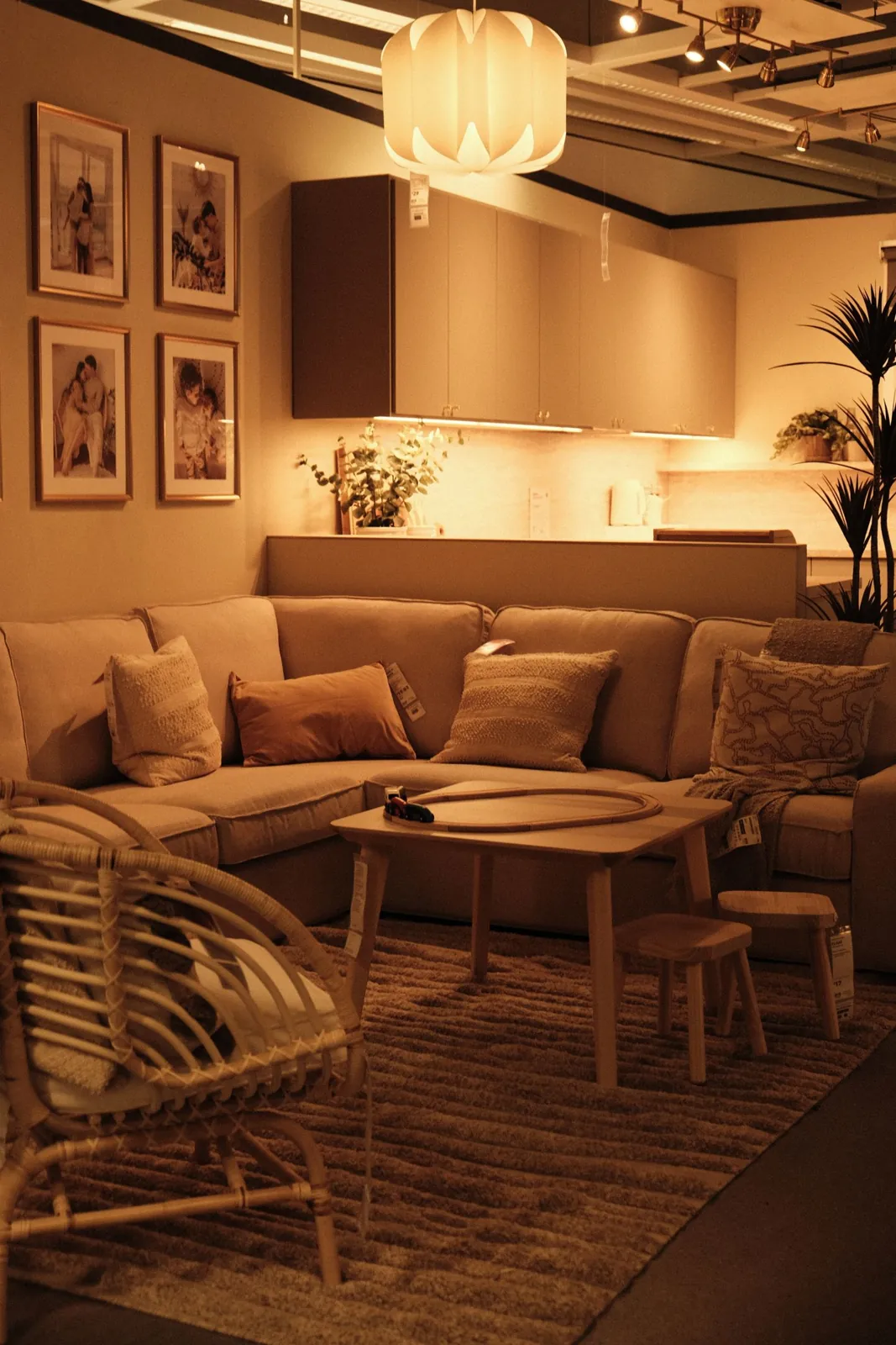 Sofa, cushions and warm lamps in a cosy room