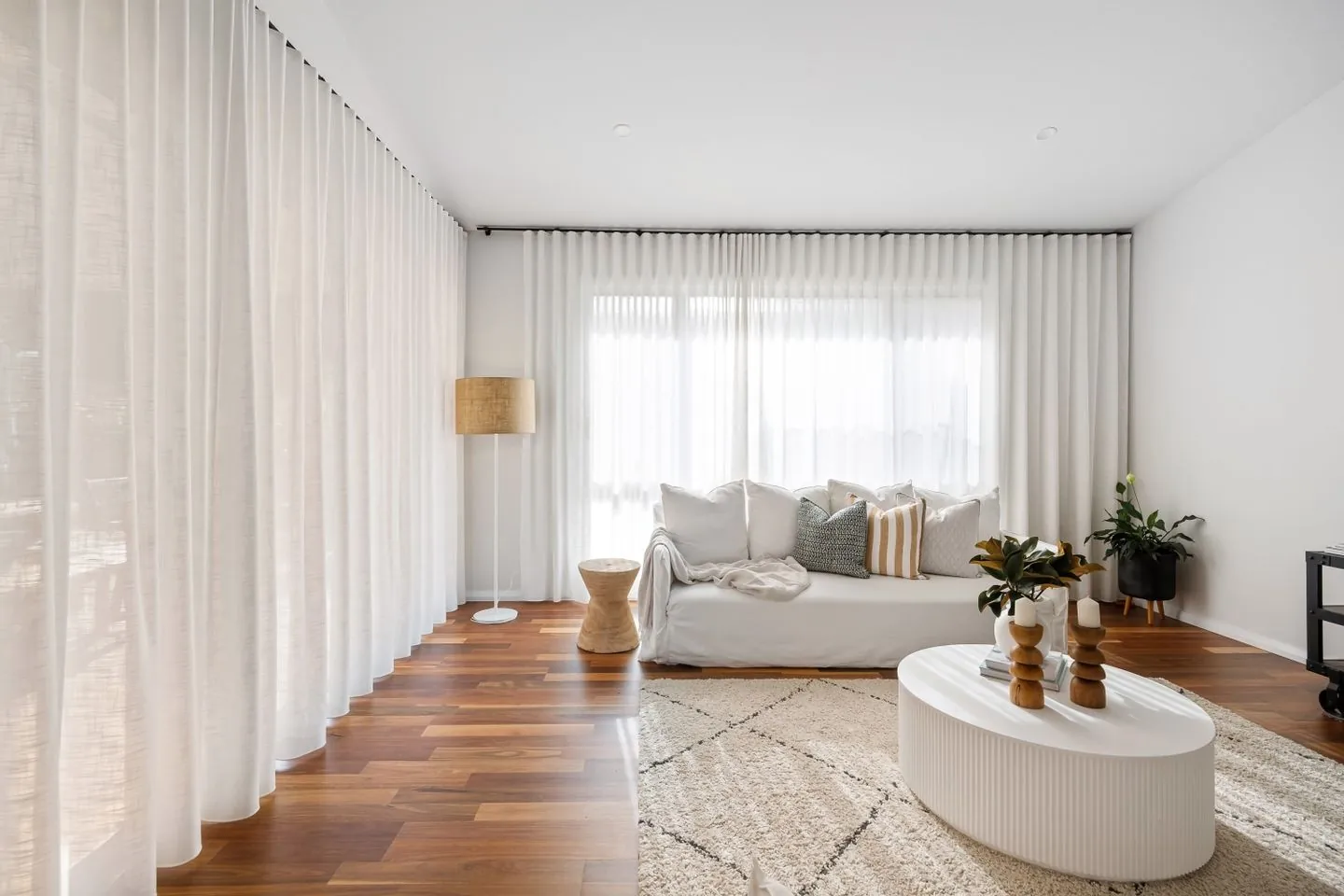 Light living room with a sofa and round coffee table