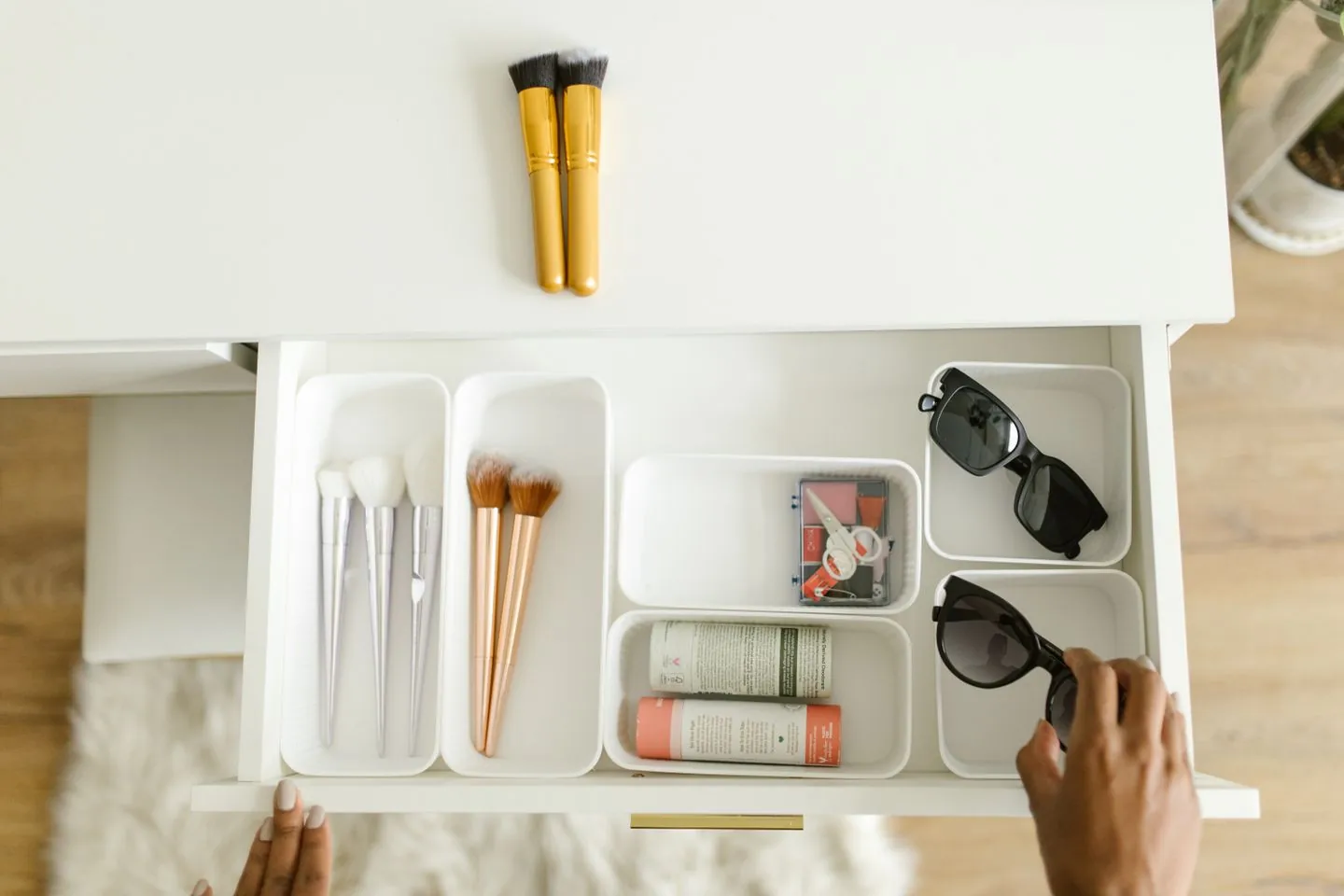 Personal care items divided into small drawer trays